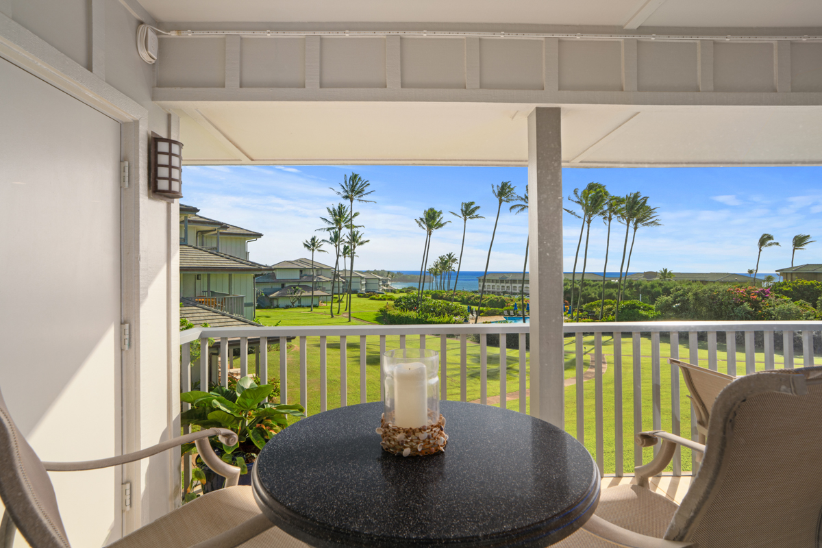 1565 Pe'e Road, Unit 125 Koloa, HI 96756 - Photo 8 of 19 a view of a dining room with furniture one side kitchen view and wooden floor