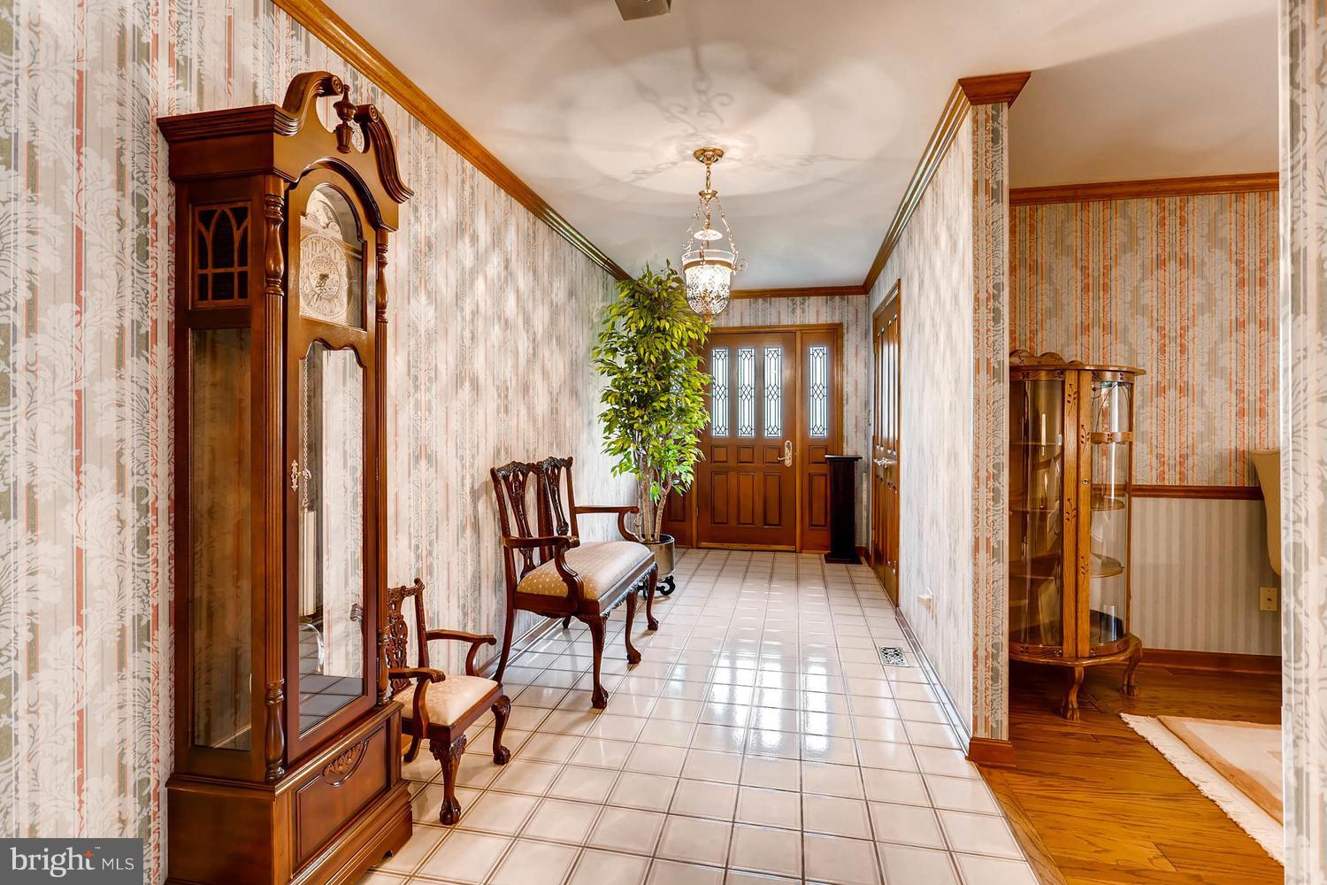 14000 Baldwin Mill Road Baldwin, MD 21013 - Photo 2 of 28 a view of a entryway with furniture and a livingroom