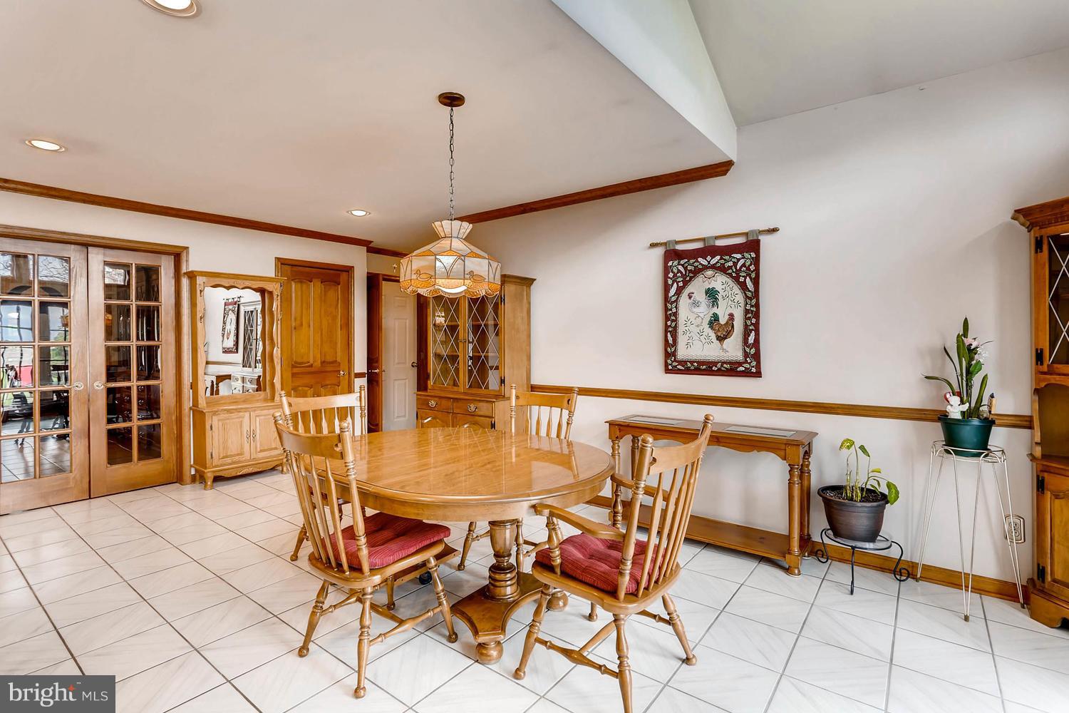 14000 Baldwin Mill Road Baldwin, MD 21013 - Photo 7 of 28 a view of a dining room with furniture and wooden floor