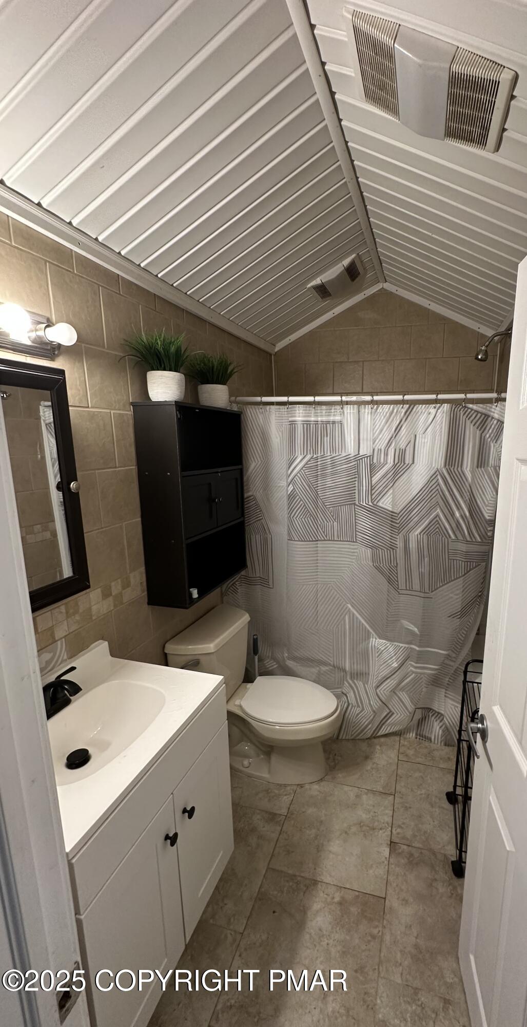 2656 Woodruff Lane, Unit B Stroudsburg, PA 18360 - Photo 8 of 8 a bathroom with a sink a toilet and shower
