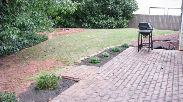 a view of a backyard with sitting area