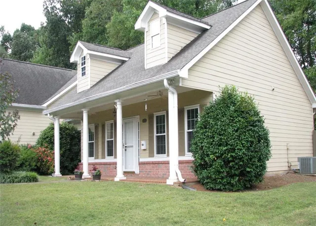 front view of a house with a yard
