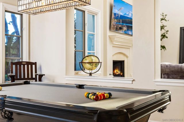 a bedroom with a bed and a fireplace