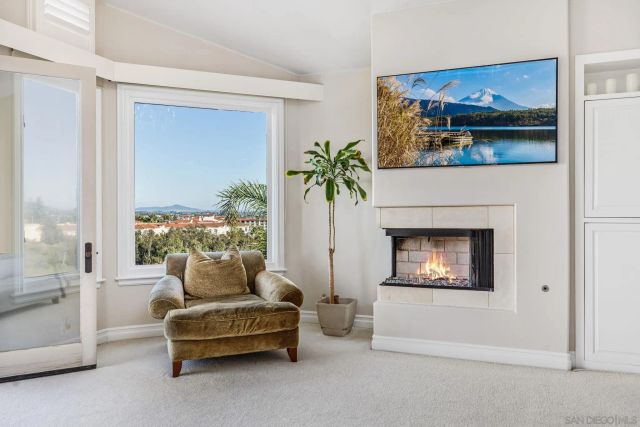 a large bathroom with a double vanity sink a large mirror and a bathtub