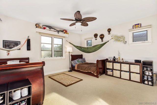 a view of house with swimming pool outdoor seating