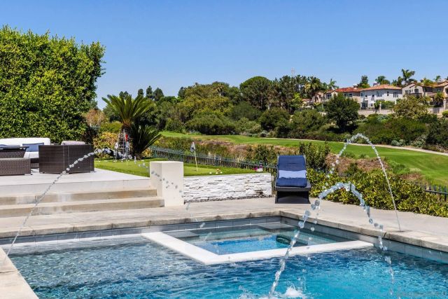 a view of a swimming pool with a patio
