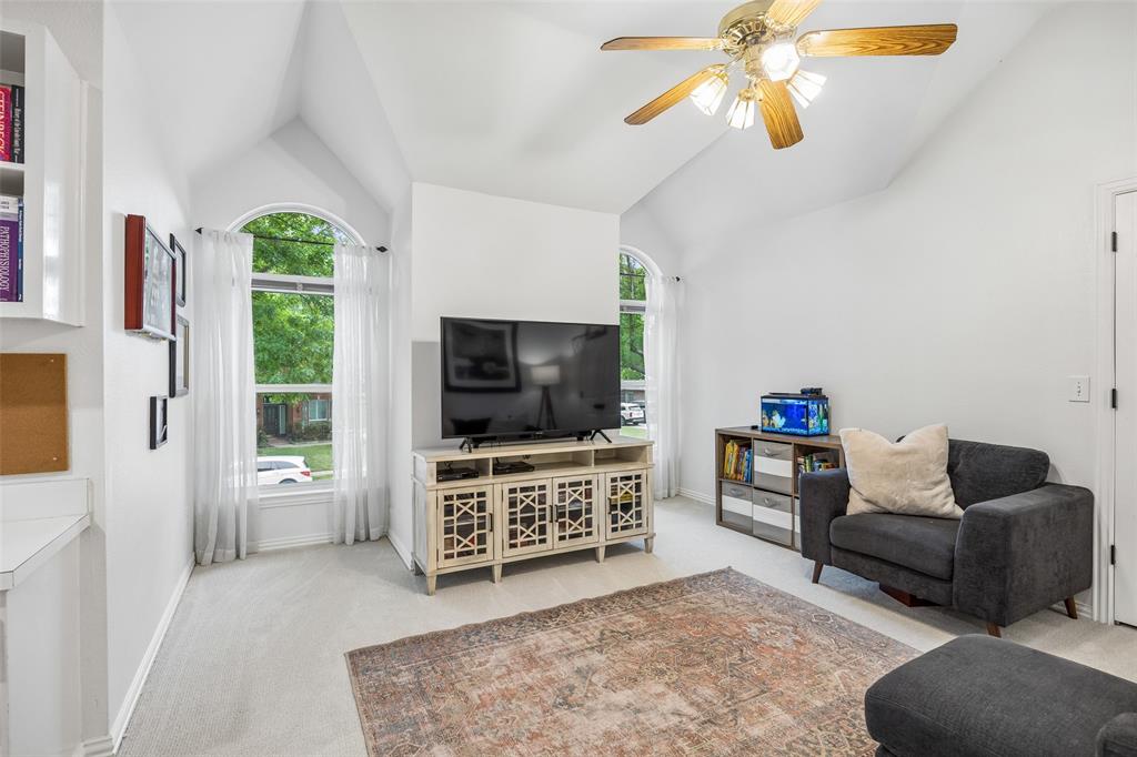 5511 South Briar Ridge Circle McKinney, TX 75072 - Photo 20 of 35 a living room with furniture and a flat screen tv