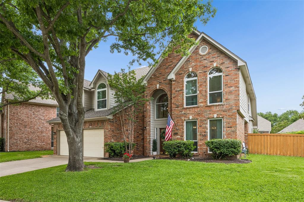 5511 South Briar Ridge Circle McKinney, TX 75072 - Photo 2 of 35 a view of a brick house with a yard
