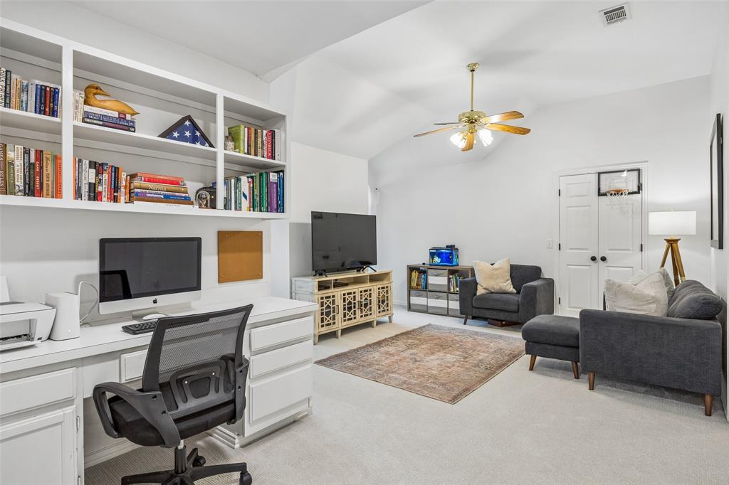 5511 South Briar Ridge Circle McKinney, TX 75072 - Photo 21 of 35 a view of a livingroom with workspace and a couch