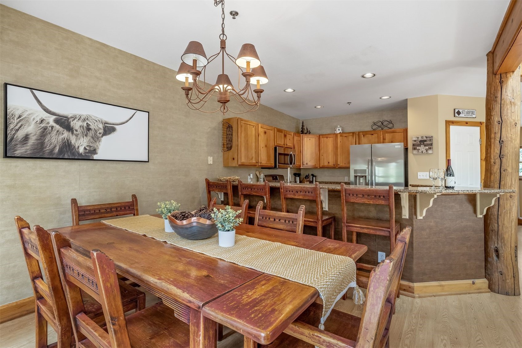 71 Starfire Lane, Unit 1978 Keystone, CO 80435 - Photo 13 of 40 a view of a dining room with furniture a kitchen and chandelier