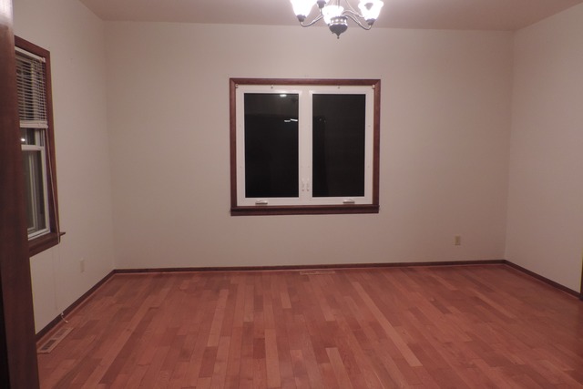 29448 Quigley Road Manhattan, IL 60442 - Photo 4 of 11 a view of an empty room with wooden floor and a window