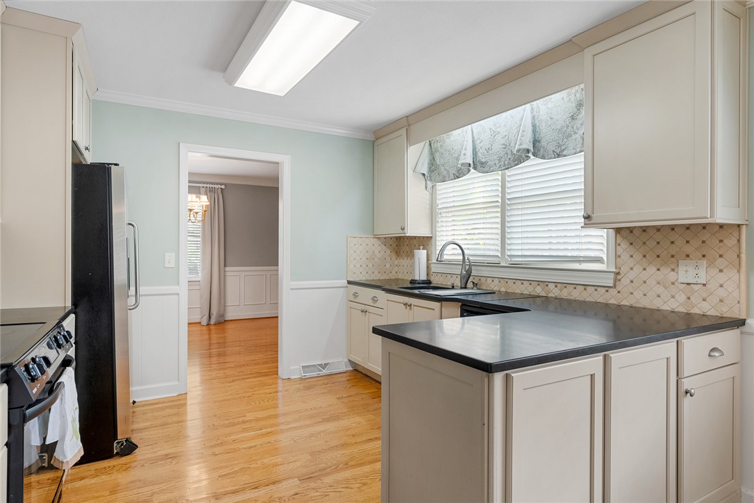 1211 Melbourne Drive Anderson, SC 29621 - Photo 13 of 35 This bright kitchen features ample counter space and offers an inviting view into an adjacent room.