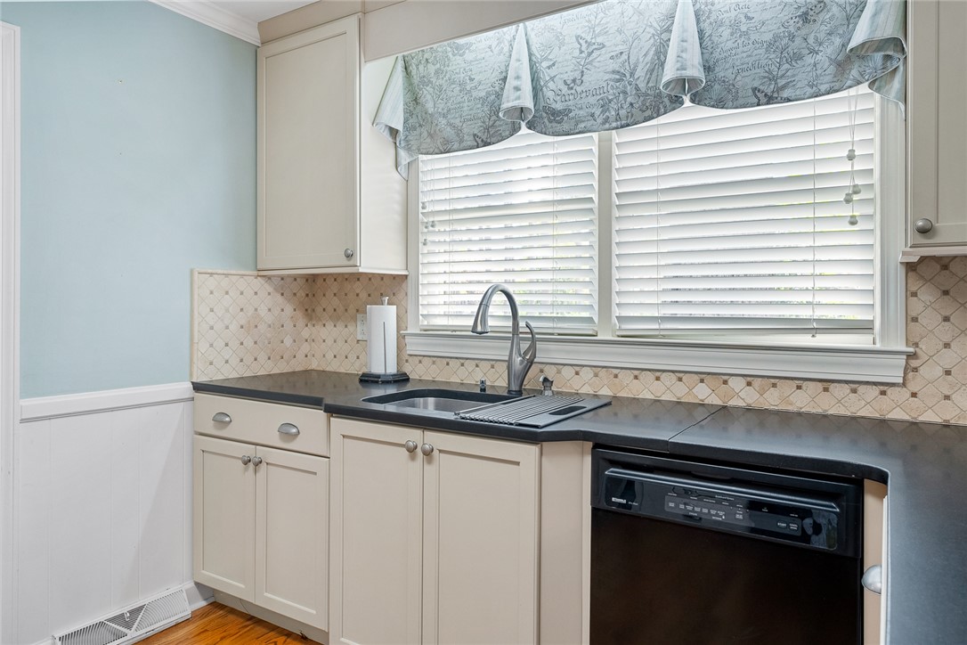 1211 Melbourne Drive Anderson, SC 29621 - Photo 14 of 35 This functional kitchen features ample counter space, streamlined appliances, and a window for natural light.