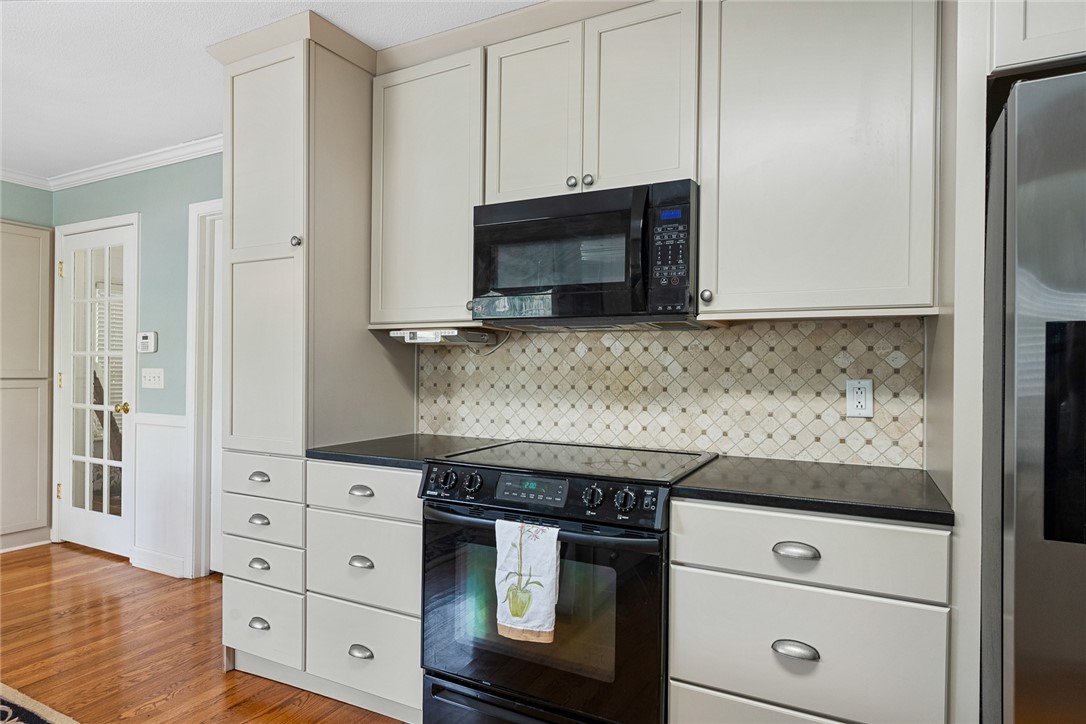 1211 Melbourne Drive Anderson, SC 29621 - Photo 15 of 35 This bright kitchen features ample cabinetry and modern appliances, perfect for everyday meals and entertaining.