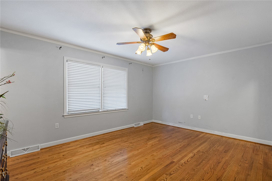 1211 Melbourne Drive Anderson, SC 29621 - Photo 20 of 35 This versatile room features warm hardwood floors and abundant natural light, creating an inviting atmosphere.