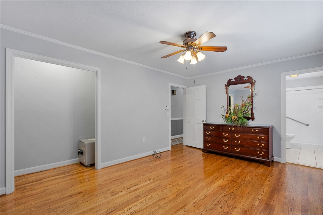 1211 Melbourne Drive Anderson, SC 29621 - Photo 21 of 35 This primary bedroom boasts gleaming hardwood floors, providing a serene retreat for homeowners.