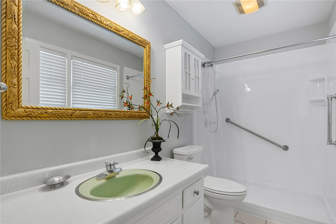 1211 Melbourne Drive Anderson, SC 29621 - Photo 22 of 35 Bright and clean bathroom featuring a practical vanity with a sink and a functional shower area.