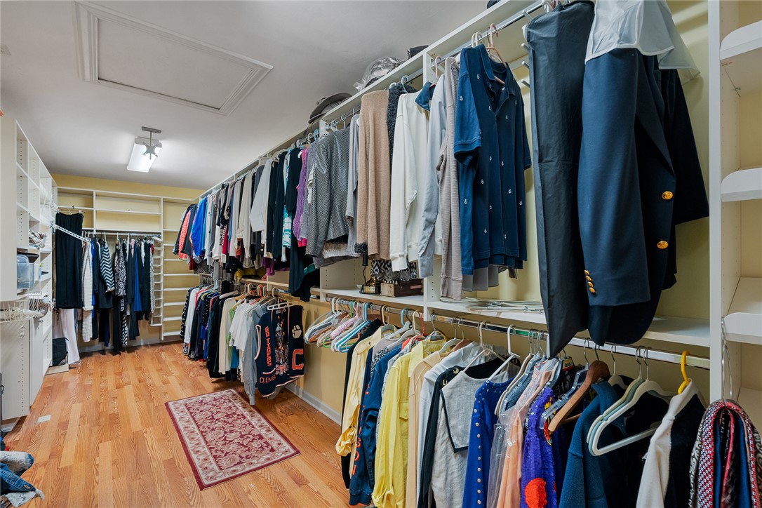 1211 Melbourne Drive Anderson, SC 29621 - Photo 23 of 35 The primary bedroom walk-in closet offers ample storage and organization for an extensive wardrobe.