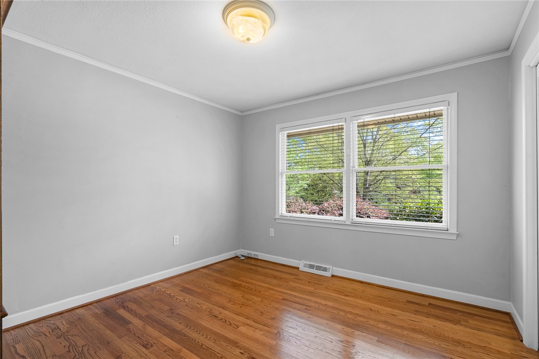 1211 Melbourne Drive Anderson, SC 29621 - Photo 27 of 35 This spacious room features ample natural light and beautiful wood flooring.