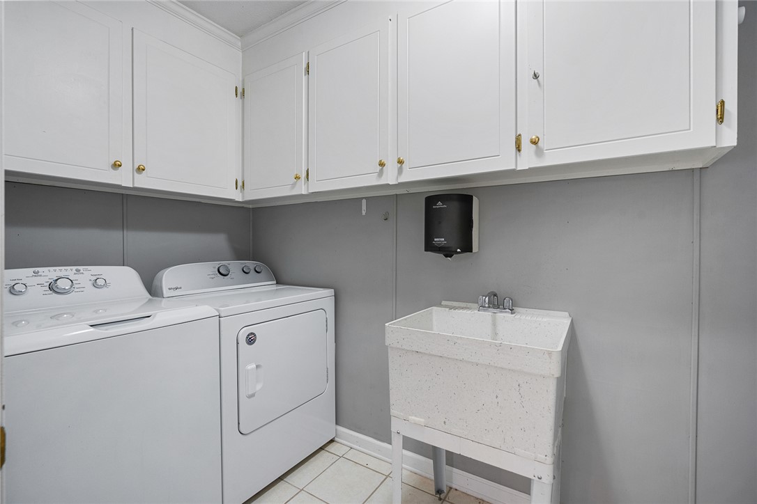 1211 Melbourne Drive Anderson, SC 29621 - Photo 28 of 35 Functional laundry space featuring convenient appliances and ample storage.