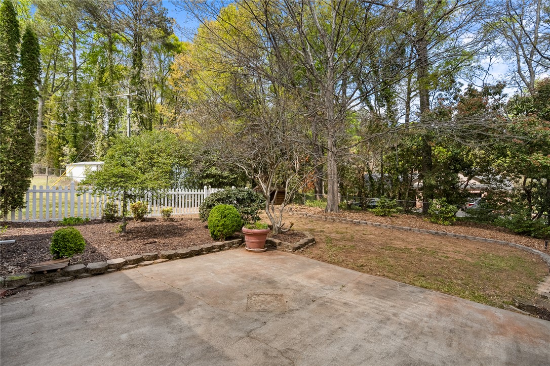 1211 Melbourne Drive Anderson, SC 29621 - Photo 30 of 35 An inviting concrete patio provides a seamless transition to the verdant and private backyard.