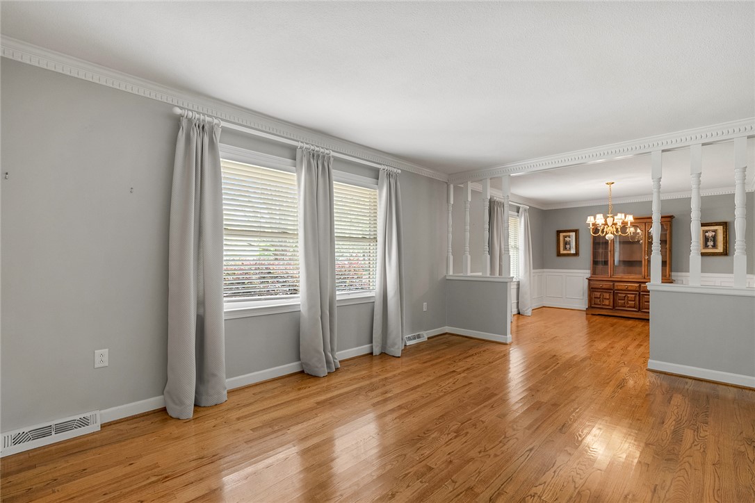 1211 Melbourne Drive Anderson, SC 29621 - Photo 5 of 35 This bright living space features polished hardwood floors, elegant crown molding, and abundant natural light.