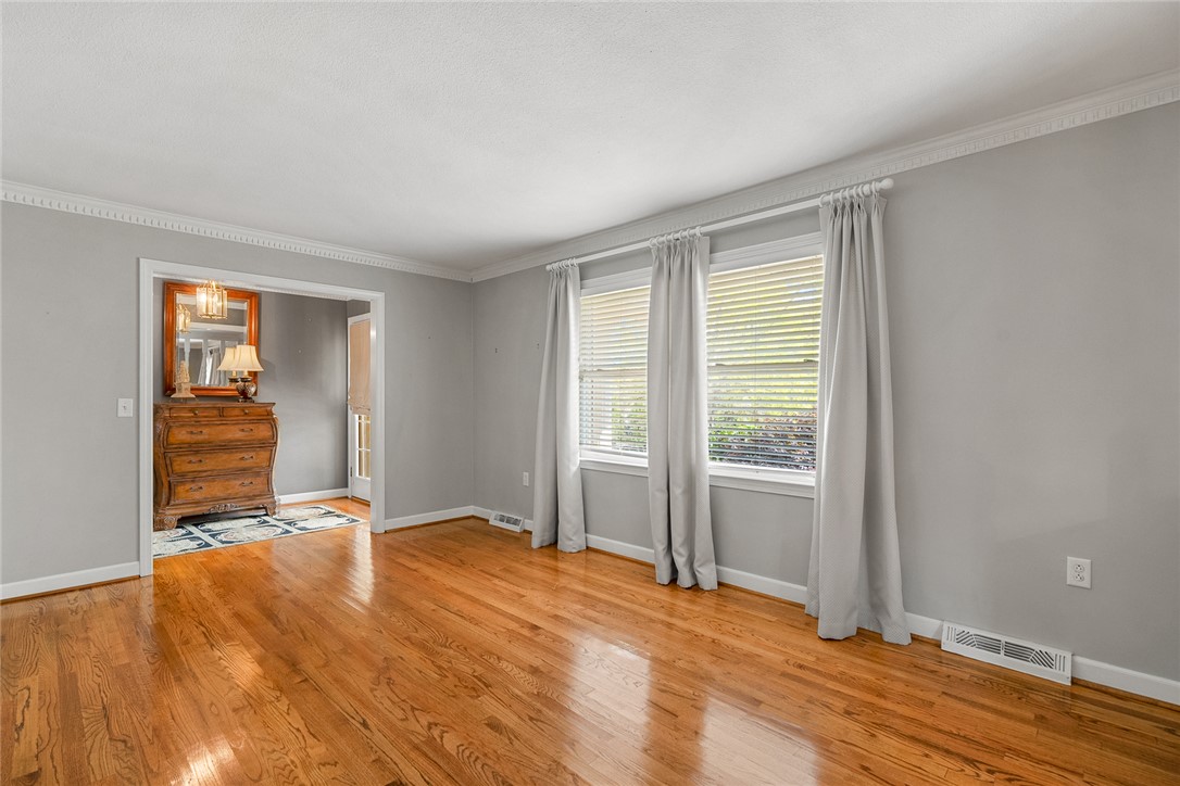 1211 Melbourne Drive Anderson, SC 29621 - Photo 6 of 35 This inviting space features lustrous wood flooring and abundant natural light through multiple windows.