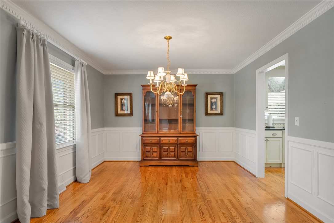 1211 Melbourne Drive Anderson, SC 29621 - Photo 7 of 35 This elegant space features hardwood floors and classic crown molding, ideal for memorable gatherings.