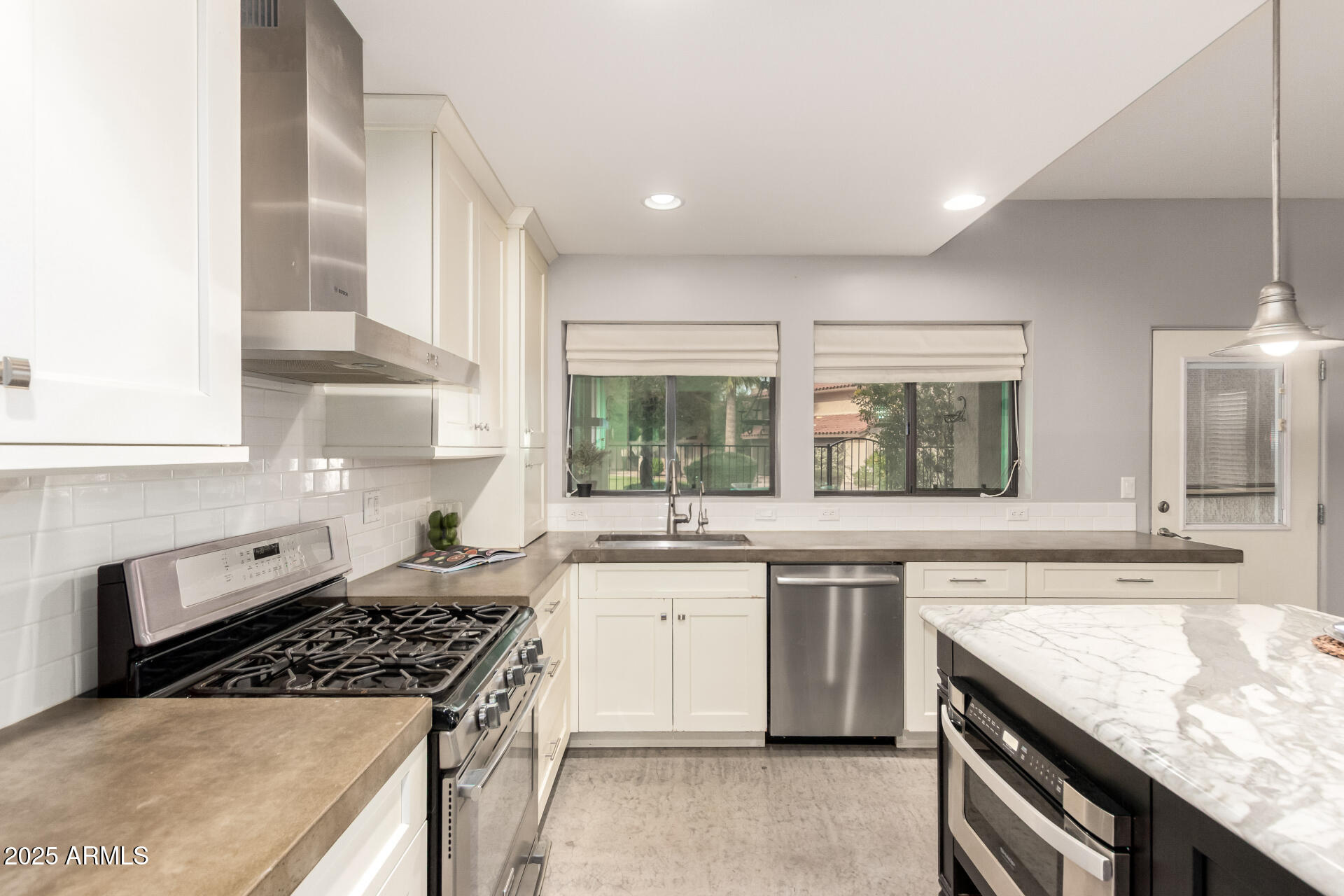 943 East Kortsen Road, Unit 10 Casa Grande, AZ 85122 - Photo 14 of 35 a large kitchen with granite countertop a stove and a sink