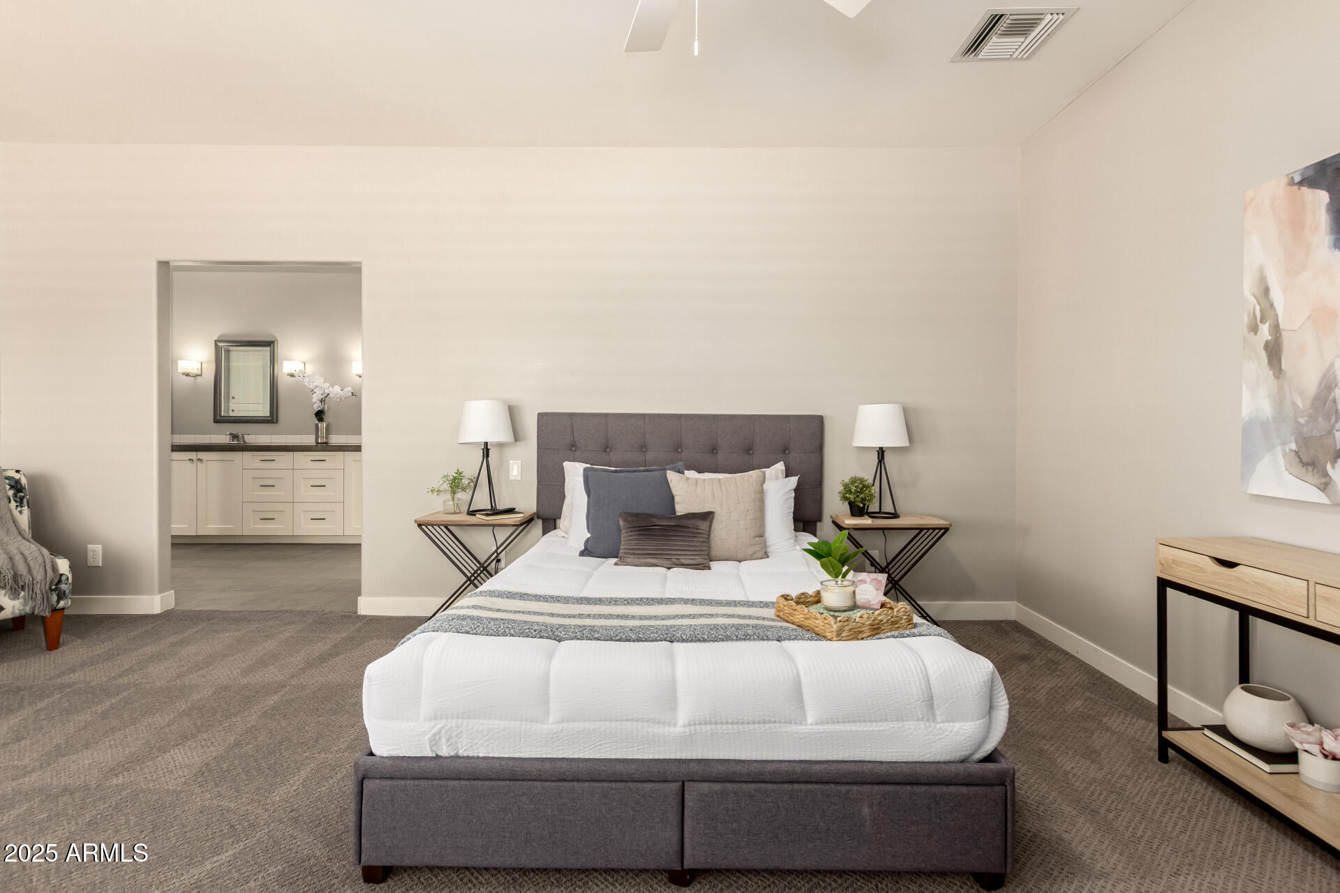 943 East Kortsen Road, Unit 10 Casa Grande, AZ 85122 - Photo 17 of 35 a bedroom with a bed and a table