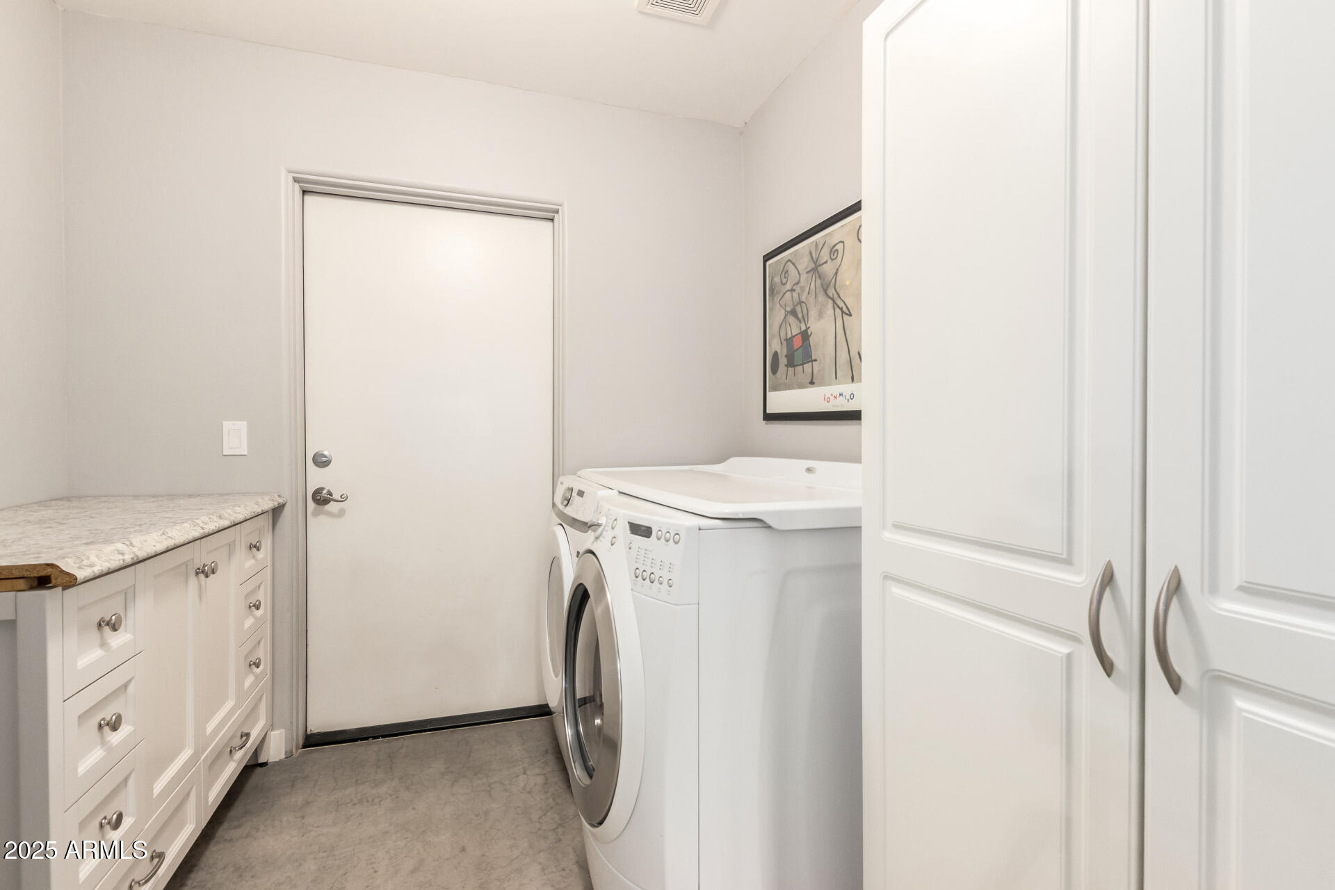 943 East Kortsen Road, Unit 10 Casa Grande, AZ 85122 - Photo 32 of 35 a utility room with dryer and washer