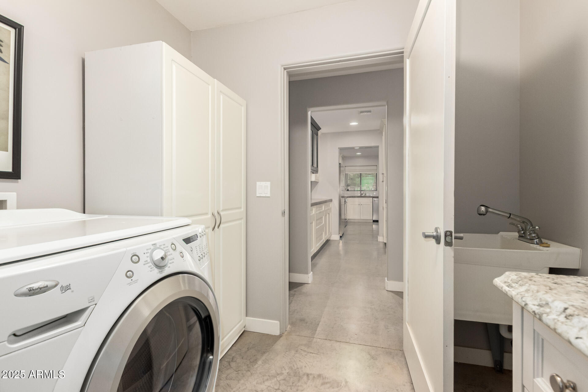 943 East Kortsen Road, Unit 10 Casa Grande, AZ 85122 - Photo 33 of 35 a view of a hallway with washer and dryer