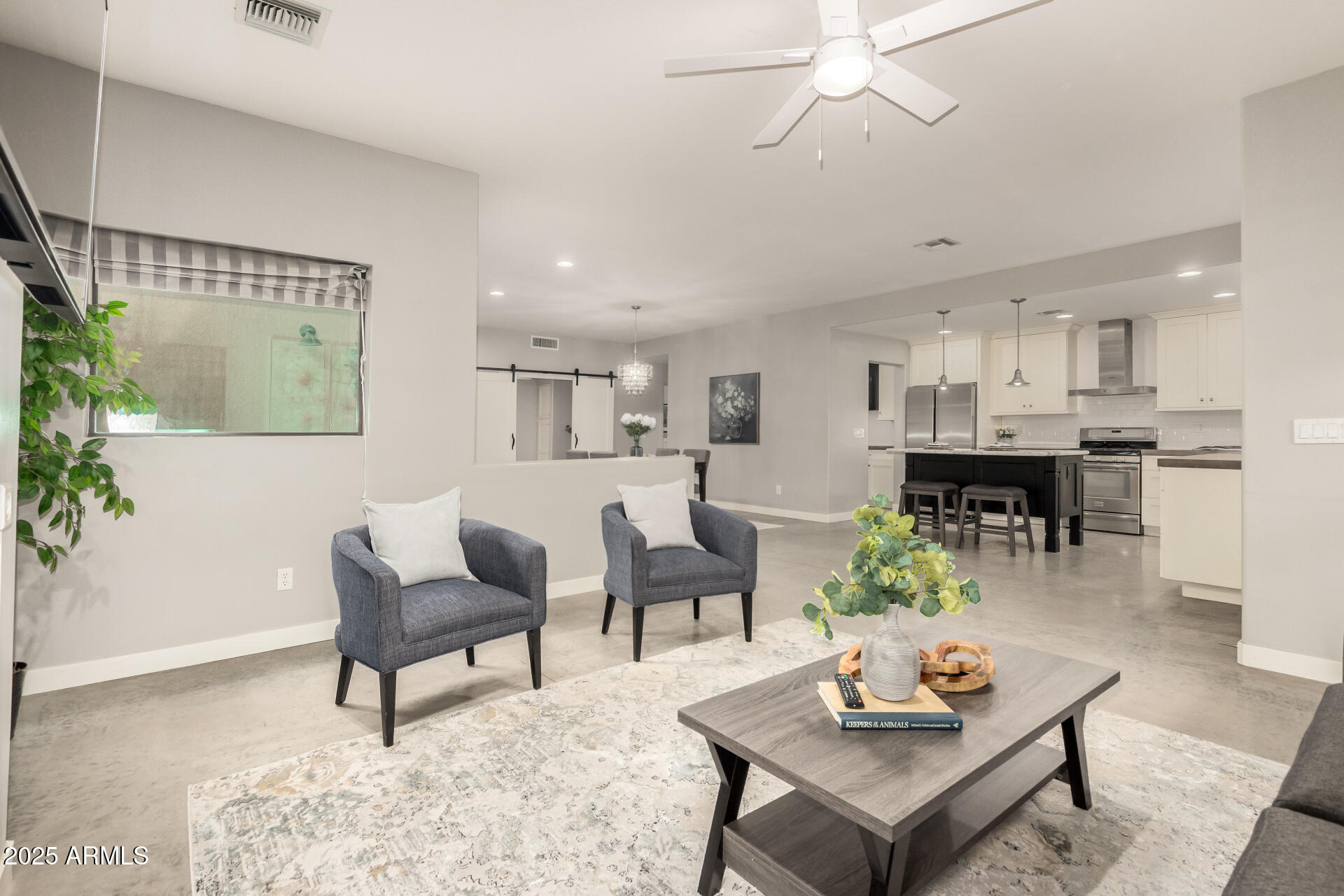 943 East Kortsen Road, Unit 10 Casa Grande, AZ 85122 - Photo 7 of 35 a living room with furniture and kitchen view
