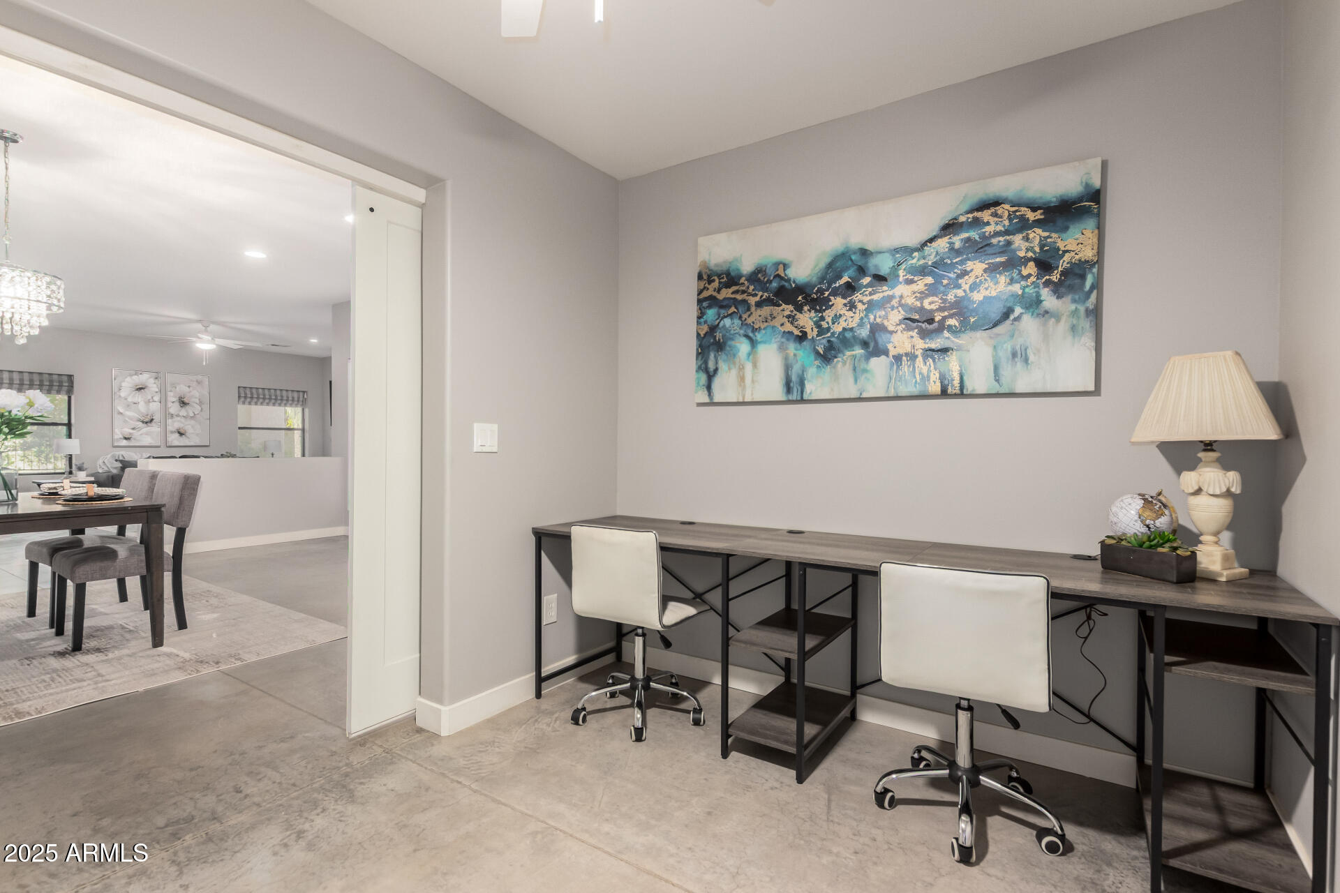 943 East Kortsen Road, Unit 10 Casa Grande, AZ 85122 - Photo 9 of 35 a view of a dining room with furniture and a chandelier