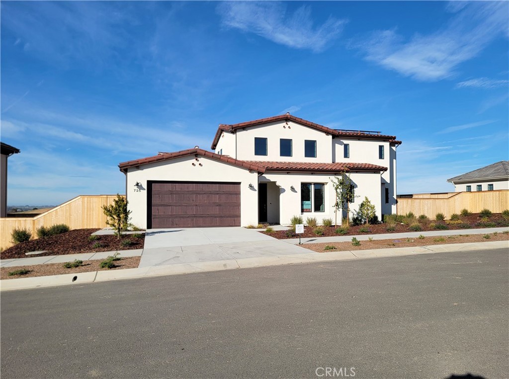 725 Manor Lane Paso Robles, CA 93446 - Photo 2 of 29 a front door view of a house with a garden