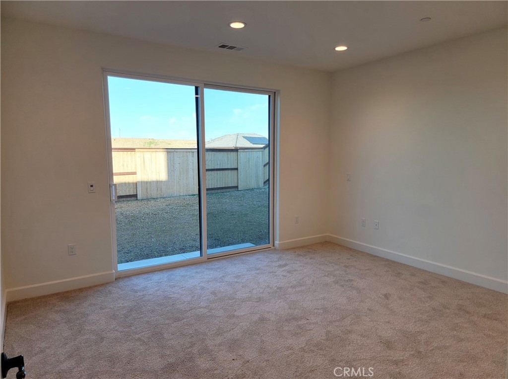 725 Manor Lane Paso Robles, CA 93446 - Photo 9 of 29 an empty room with sliding glass door