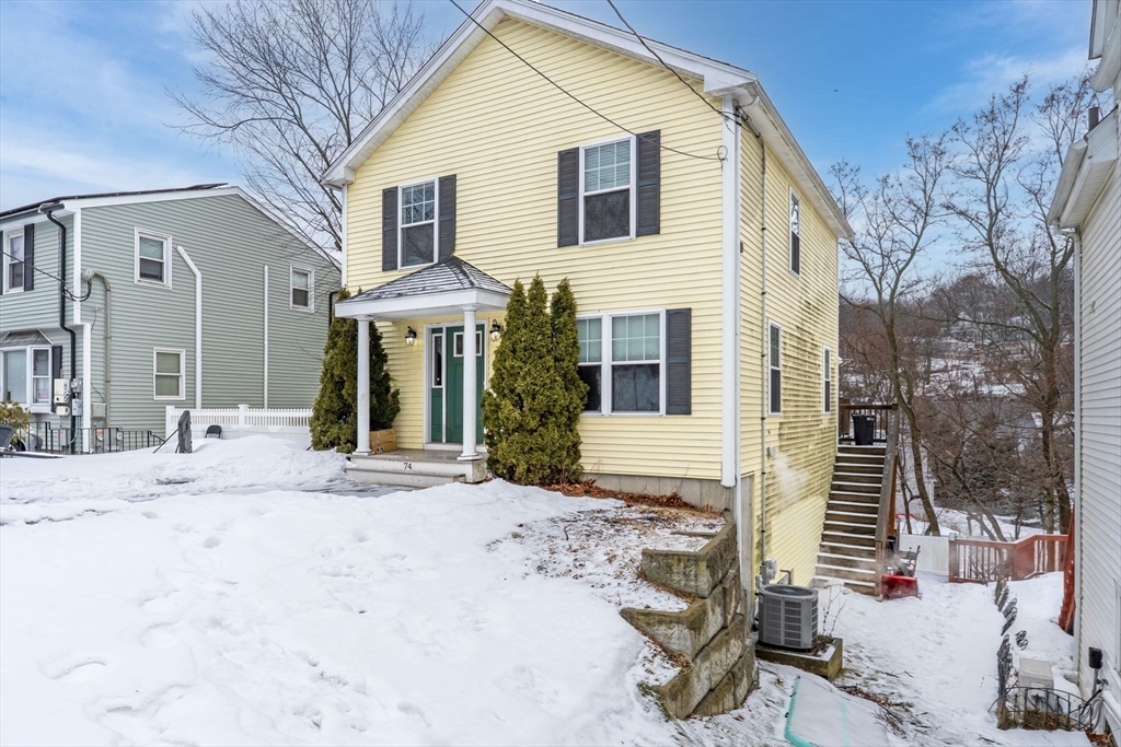 74 Linwood Street Lynn, MA 01905 - Photo 2 of 37 a front view of a house with a yard