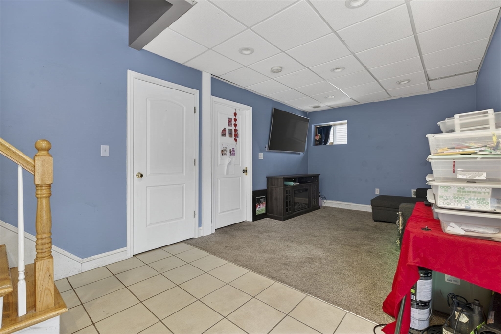 74 Linwood Street Lynn, MA 01905 - Photo 23 of 37 a view of a livingroom with workspace and a window