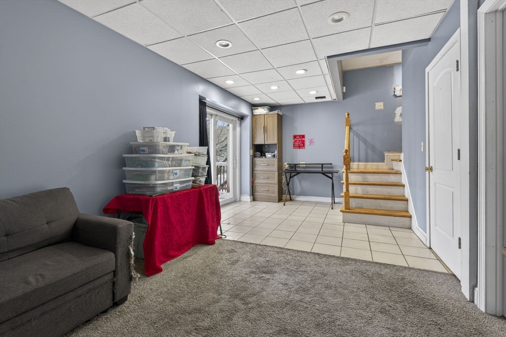 74 Linwood Street Lynn, MA 01905 - Photo 26 of 37 a living room with furniture and a flat screen tv