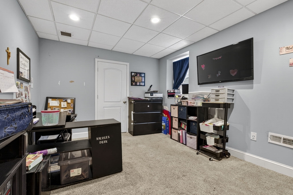 74 Linwood Street Lynn, MA 01905 - Photo 27 of 37 a room with furniture and a flat screen tv
