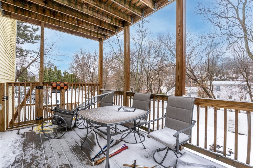 74 Linwood Street Lynn, MA 01905 - Photo 29 of 37 a view of a patio with table and chairs and wooden floor