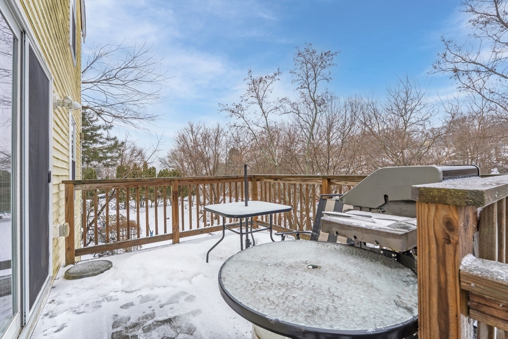 74 Linwood Street Lynn, MA 01905 - Photo 30 of 37 a view of a balcony with two chairs and a wooden floor