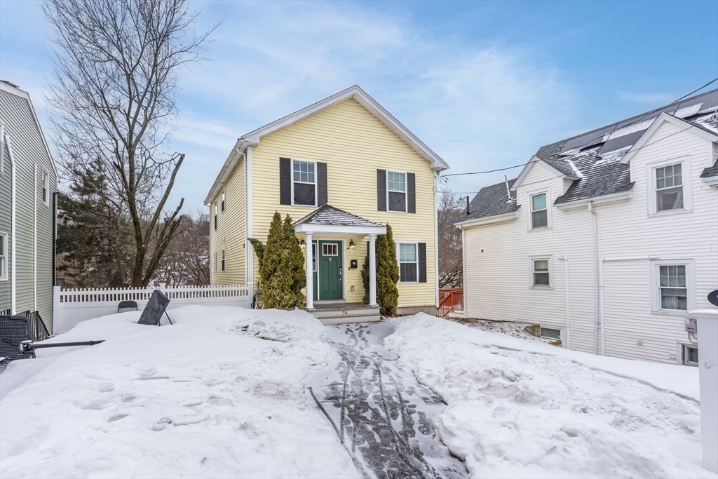 74 Linwood Street Lynn, MA 01905 - Photo 37 of 37 a view of a house with a yard covered in snow