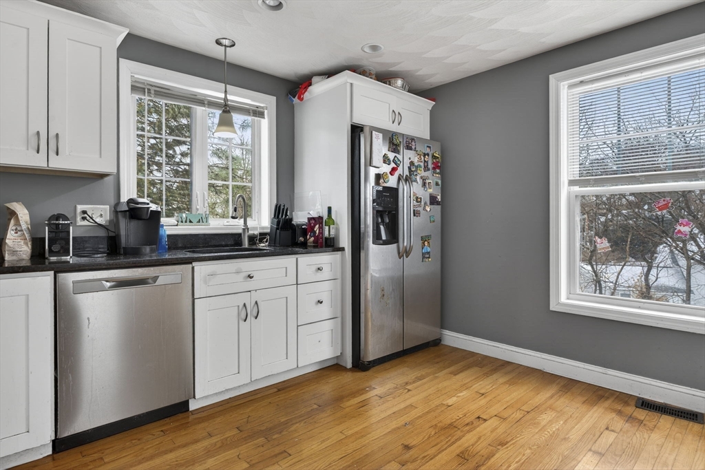 74 Linwood Street Lynn, MA 01905 - Photo 4 of 37 a kitchen with stainless steel appliances granite countertop a refrigerator and a sink
