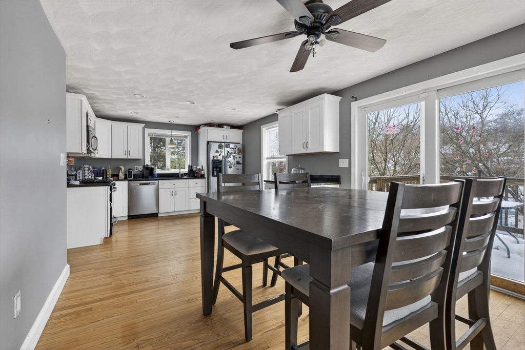 74 Linwood Street Lynn, MA 01905 - Photo 5 of 37 a kitchen with stainless steel appliances kitchen island granite countertop a table chairs sink and cabinets