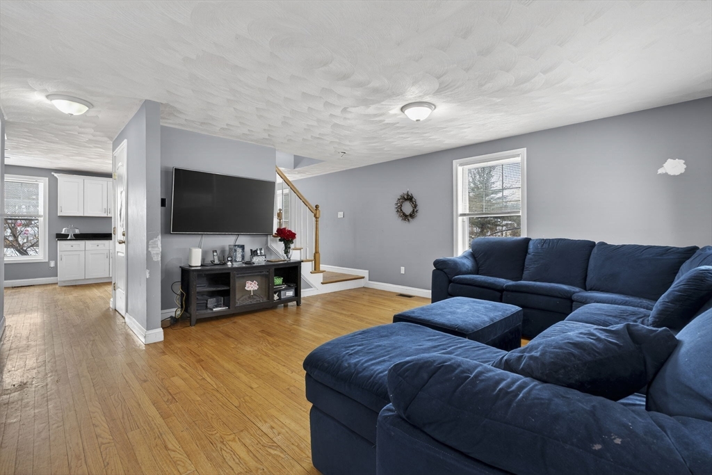 74 Linwood Street Lynn, MA 01905 - Photo 10 of 37 a living room with furniture and a flat screen tv