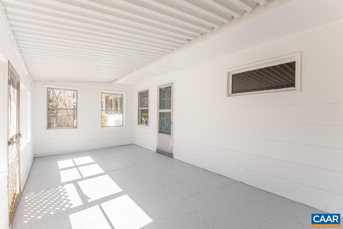 801 Poplar Spring Road Scottsville, VA 24590 - Photo 21 of 44 an empty room with windows