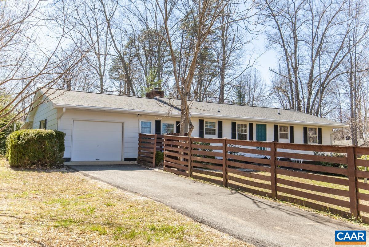 801 Poplar Spring Road Scottsville, VA 24590 - Photo 31 of 44 a front view of a house with a yard covered with snow