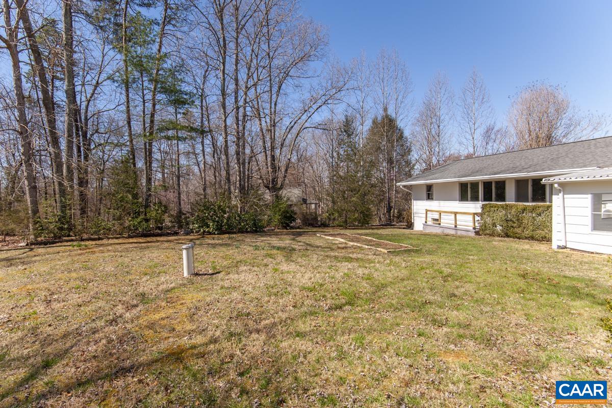801 Poplar Spring Road Scottsville, VA 24590 - Photo 37 of 44 a swimming pool with trees in front of it