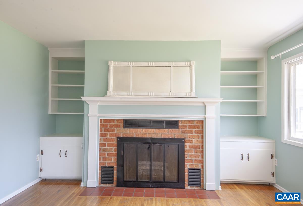 801 Poplar Spring Road Scottsville, VA 24590 - Photo 4 of 44 a living room with a fireplace